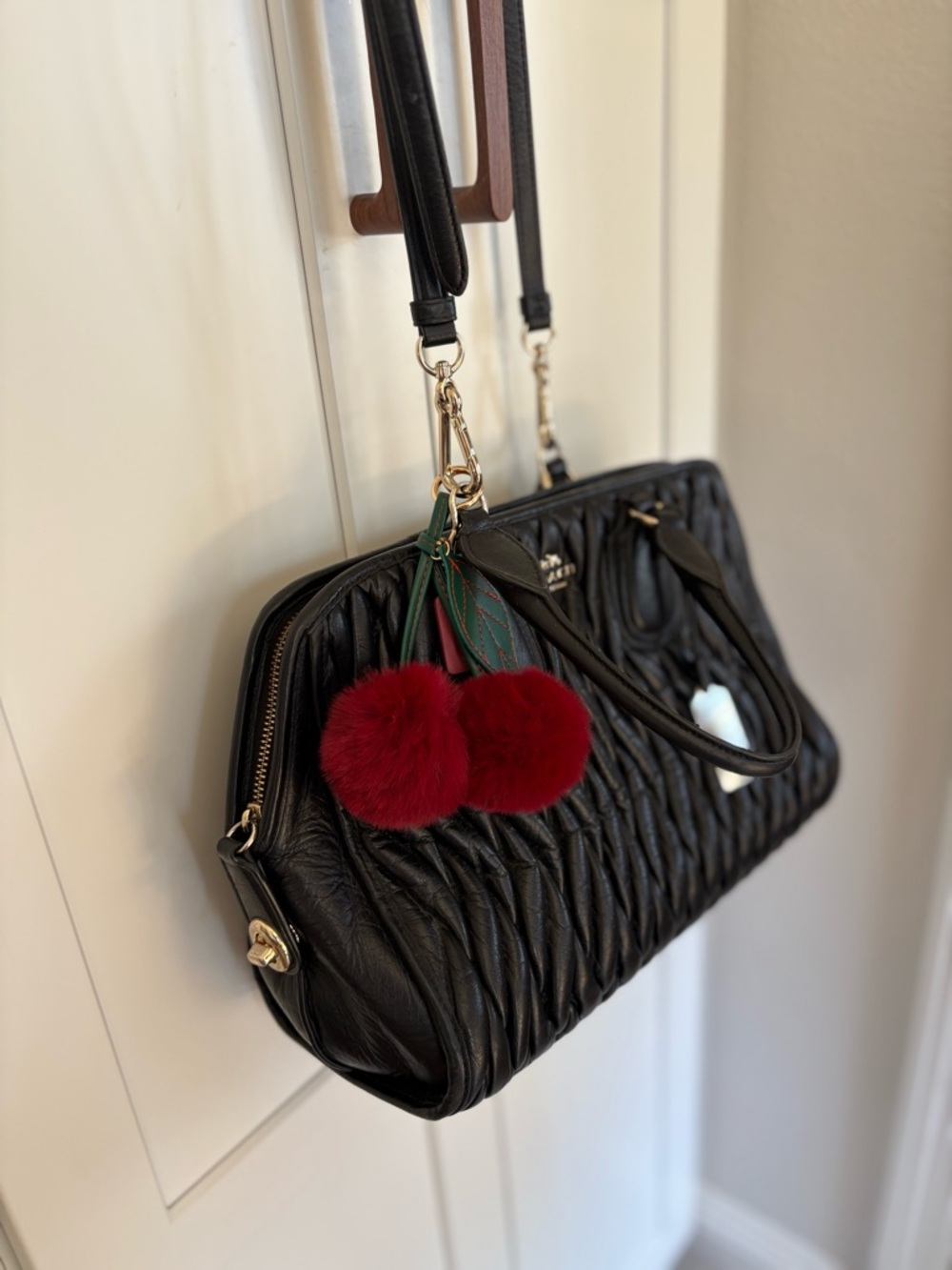 Coach Black Quilted Leather Shoulder Bag with Red Pom Pom Charm